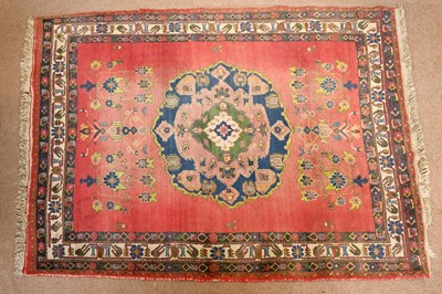 Lot 2670 - A red ground Afshar Persian rug with circular...