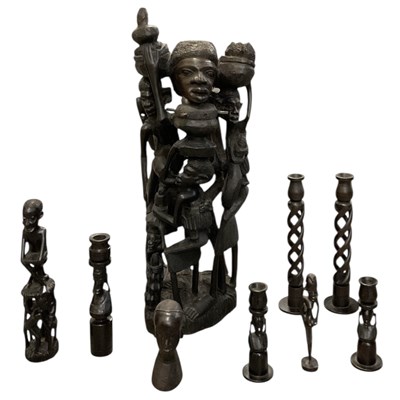 Lot 1061 - A large African carved ebony Ujamaa family...