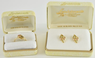 Lot 1235 - LANDSTROM'S; a 10K yellow and rose gold ring...