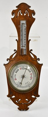 Lot 1343 - An oak android barometer with white painted...