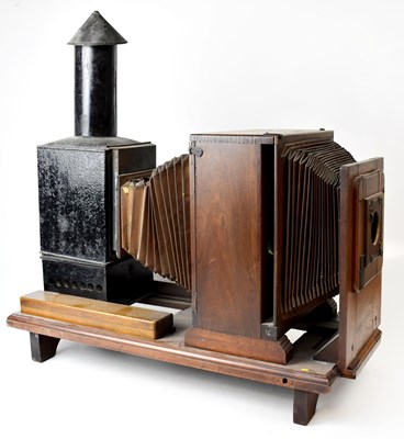 Lot 667 - A vintage wooden and metal enlarger, on a...