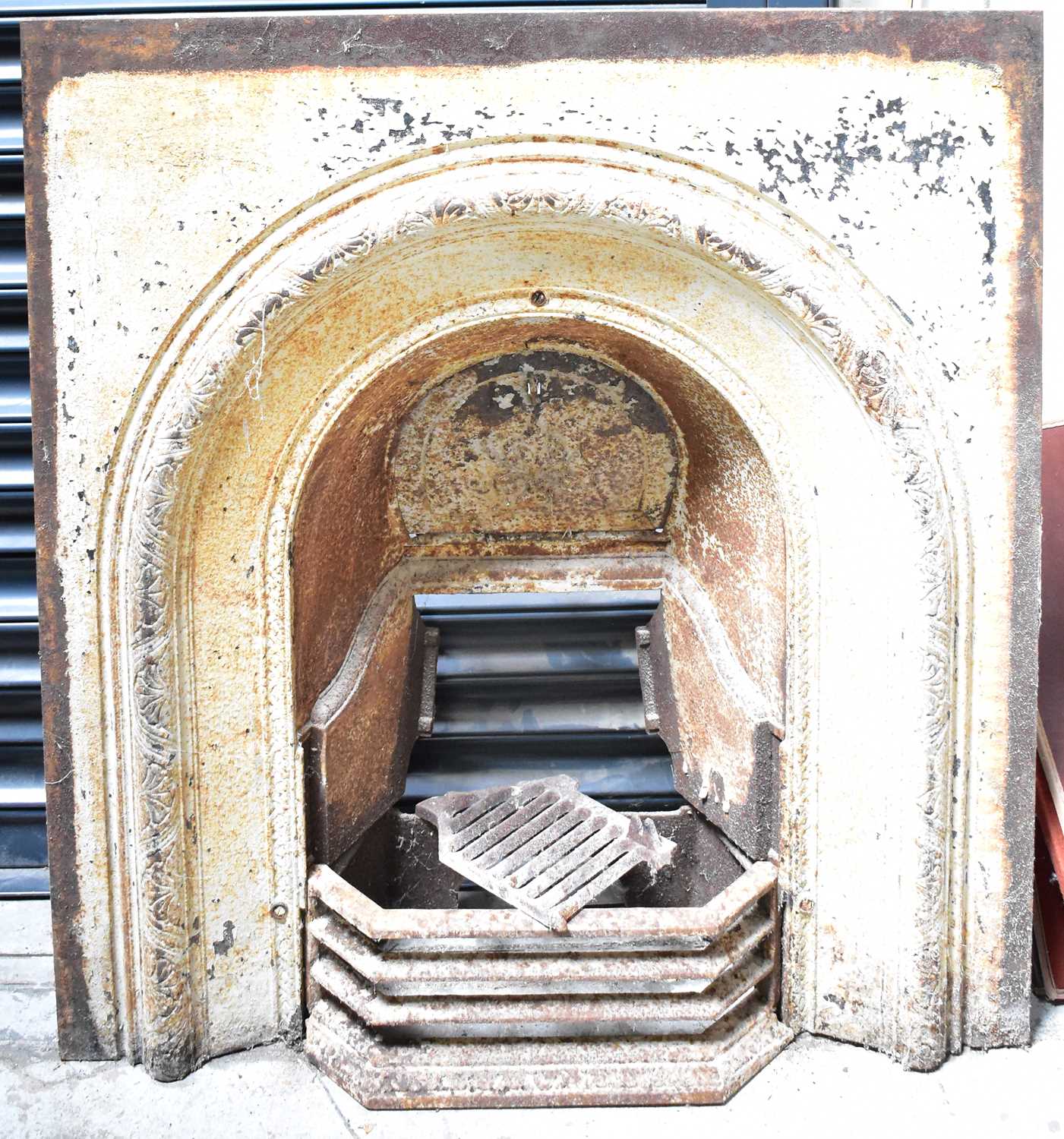 Lot 138 - A 19th century cast iron fireplace, with...
