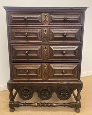 Lot 713 - An oak 19th century graduating four drawer...