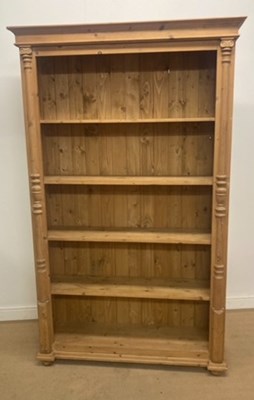 Lot 741 - A pine open bookcase with four fitted shelves,...