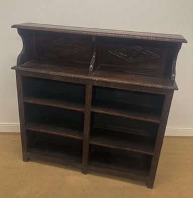 Lot 760 - A oak twin shelf open adjustable bookcase, the...