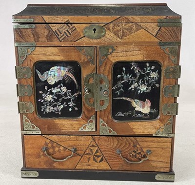 Lot 796 - A Japanese style table cabinet, with metal...