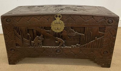 Lot 749 - A Chinese carved camphorwood slightly dome...