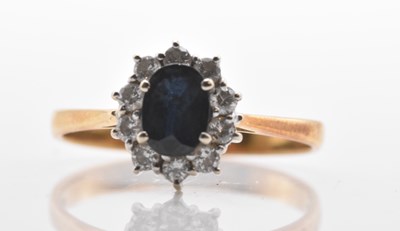 Lot 487 - An 18ct yellow gold sapphire and diamond oval...