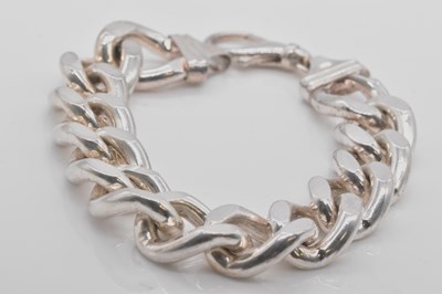 Lot 553 - A substantial silver curb link bracelet,...