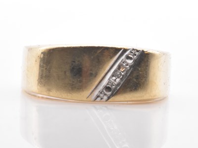 Lot 560 - A 9ct yellow gold ring set with single tiny...