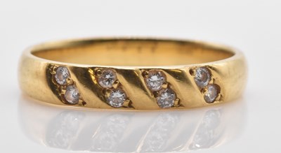 Lot 486 - An 18ct yellow gold ring set with eight round...