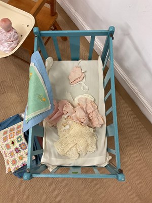 Lot 75 - A child's lowchair and a doll's cot, together...