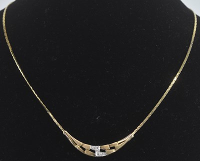 Lot 1285 - A 9ct gold necklace with contemporary crescent...