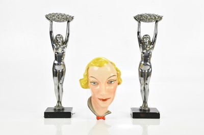 Lot 135 - A pair of Art Deco silvered metal figures...