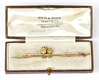 Lot 832 - A 15ct yellow gold bar brooch in the form of...