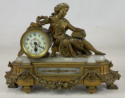 Lot 615 - A gilt and onyx eight day mantel clock with a...