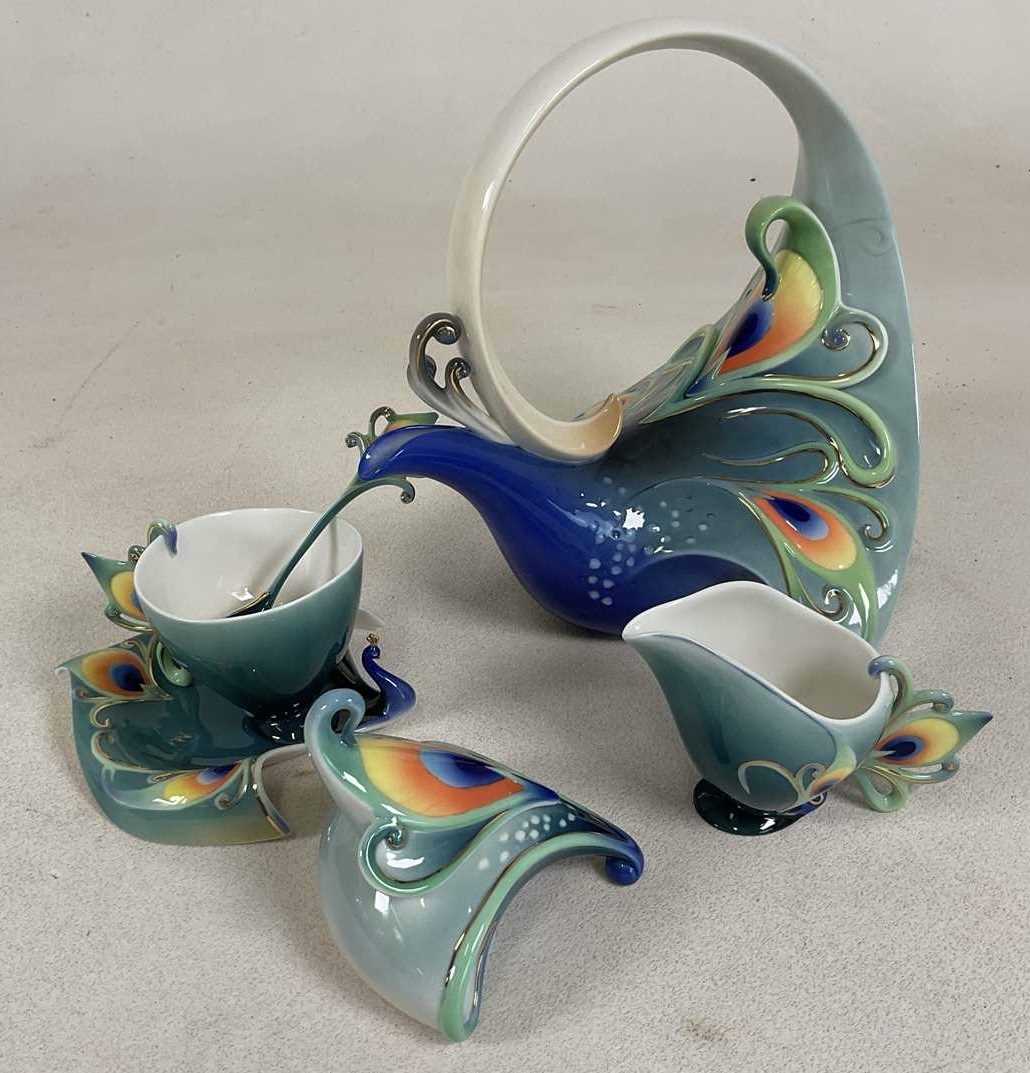 Lot 188 - FRANZ PORCELAIN; a tea set comprising teapot,...