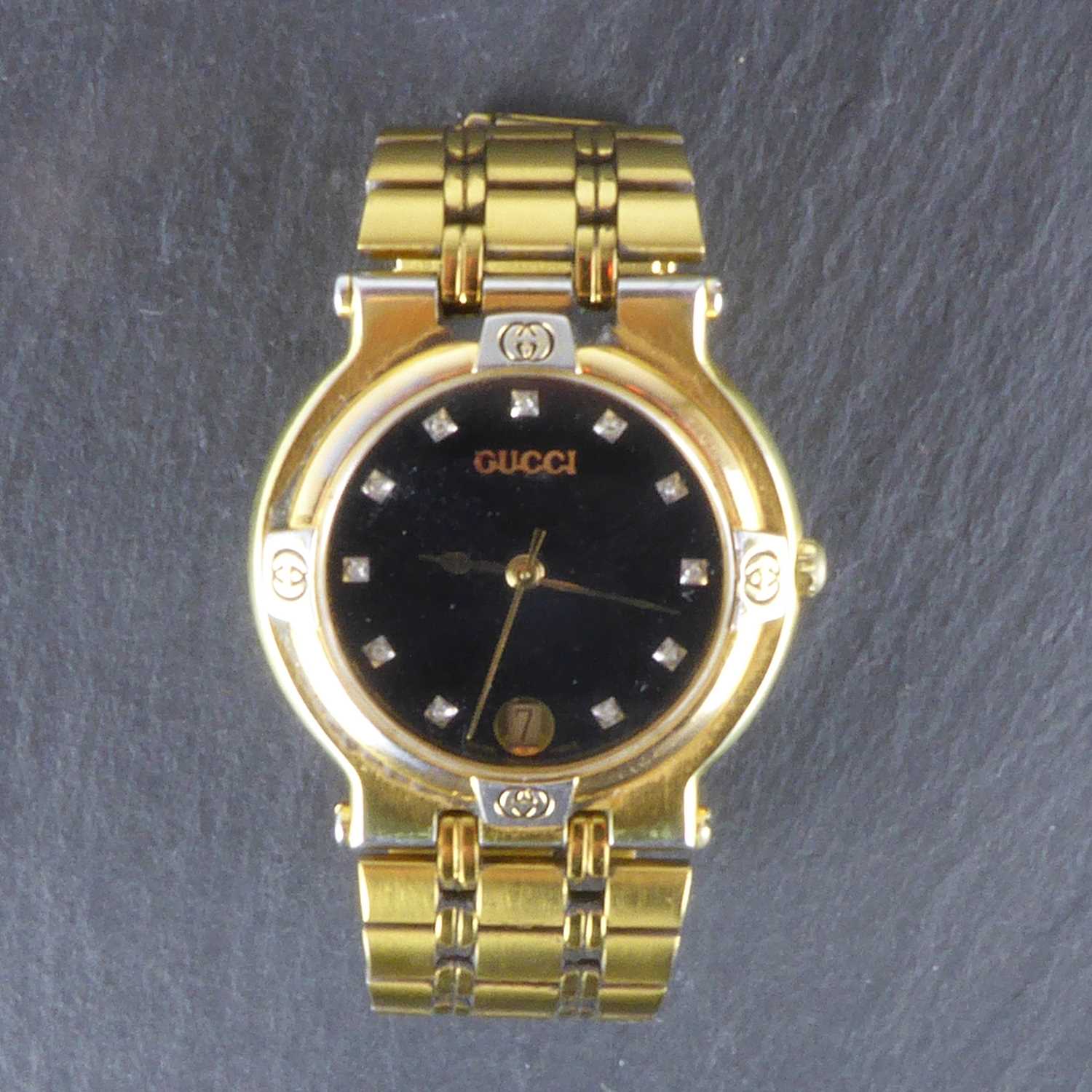 Lot 1397 - GUCCI; a ladies' gold plated wristwatch,...