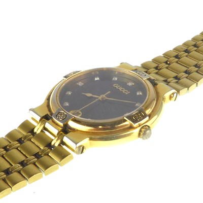 Lot 1397 - GUCCI; a ladies' gold plated wristwatch,...