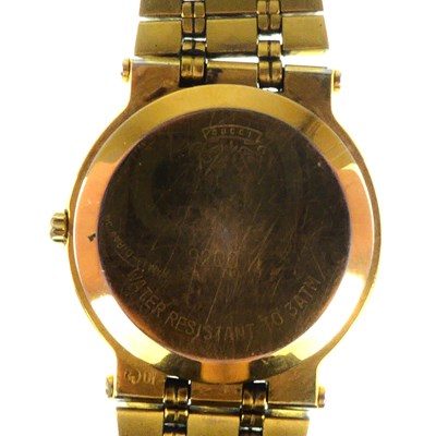 Lot 1397 - GUCCI; a ladies' gold plated wristwatch,...