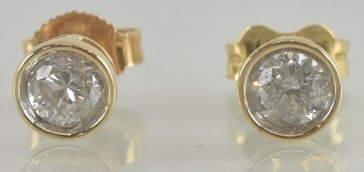 Lot 1311 - A pair of 14ct yellow gold diamond stud...