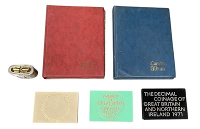 Lot 1413 - Two albums of GB coins, one containing pennies,...