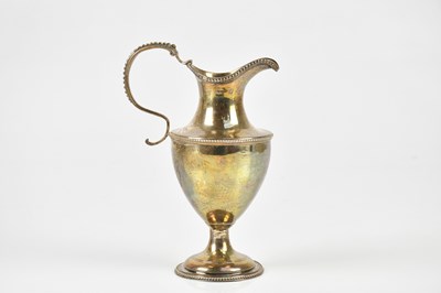 Lot 2359 - A Georgian hallmarked silver jug, London 1819,...