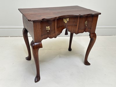Lot 1157 - An early 19th century 'red walnut' lowboy with...