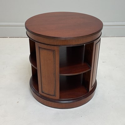 Lot 1112 - A reproduction mahogany circular revolving...