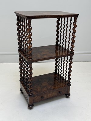 Lot 1173 - A Victorian walnut three tier whatnot, with...