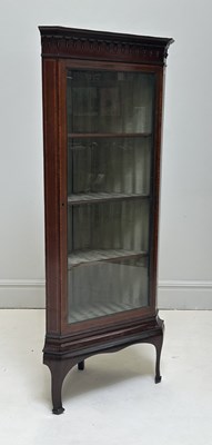 Lot 1202 - An Edwardian mahogany freestanding corner...