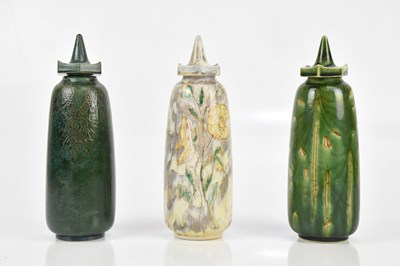 Lot 452 - COBRIDGE; three pagoda shaped jars and covers...