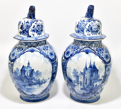 Lot 578 - A pair of of octagonal lidded jars decorated with figures in boats