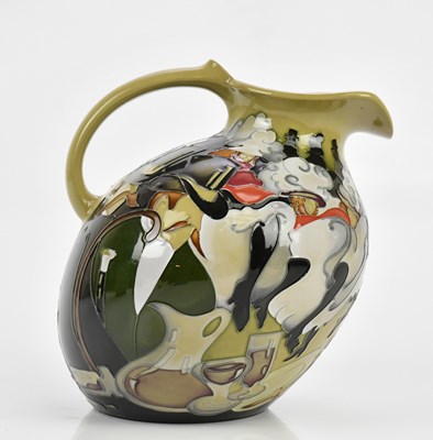 Lot 396 - MOORCROFT; an unusual flat back jug, decorated...