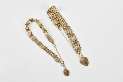 Lot 37 - Two yellow metal gate link bracelets stamped...