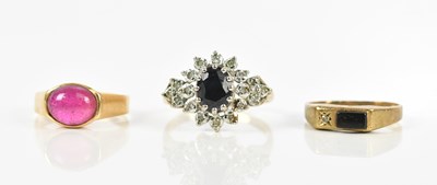 Lot 447 - A 9ct gold diamond and sapphire cluster ring,...