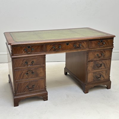 Lot 1105 - A reproduction mahogany nine drawer pedestal...