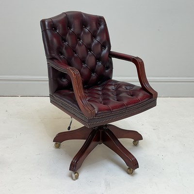 Lot 1099 - A reproduction button upholstered burgundy...