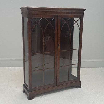 Lot 1108 - A reproduction mahogany display cabinet with...