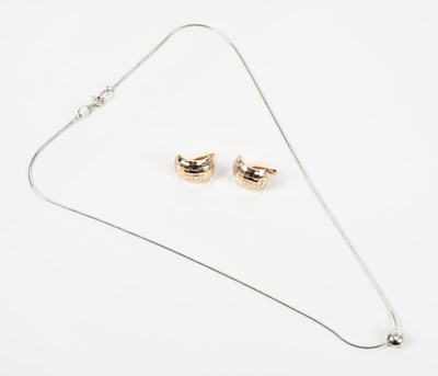 Lot 307 - A white metal diamond set pendant suspended on...