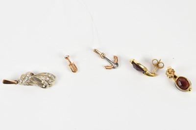 Lot 284 - A yellow metal diamond set pendant, stamped...