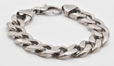 Lot 562 - A large curb link bracelet, length 24cm,...