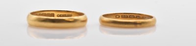 Lot 511 - Two 22ct yellow gold wedding bands, sizes K...