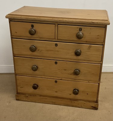 Lot 715 - A pine chest of two short over three long...