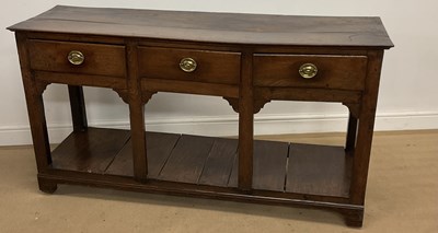 Lot 705 - A 19th century three drawer dresser base with...
