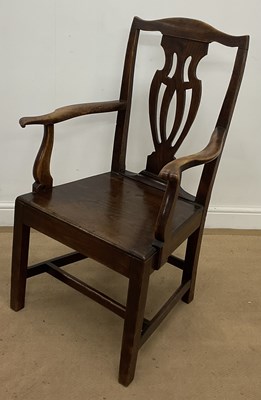 Lot 787 - An oak hall armchair, height 102cm.