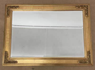 Lot 767 - A large gilt wall mirror with bevelled glass...