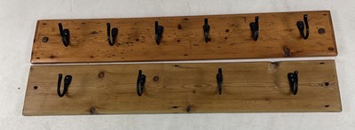 Lot 768 - A pine wall hanging coat rack with five hooks,...