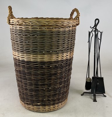 Lot 769 - A tall log basket, made by the Devon Guild of...