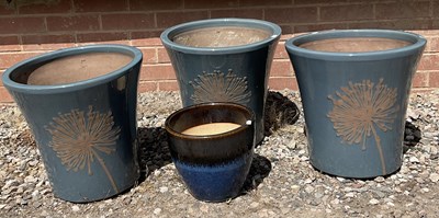 Lot 676 - Three dark blue glazed terracotta garden pots,...
